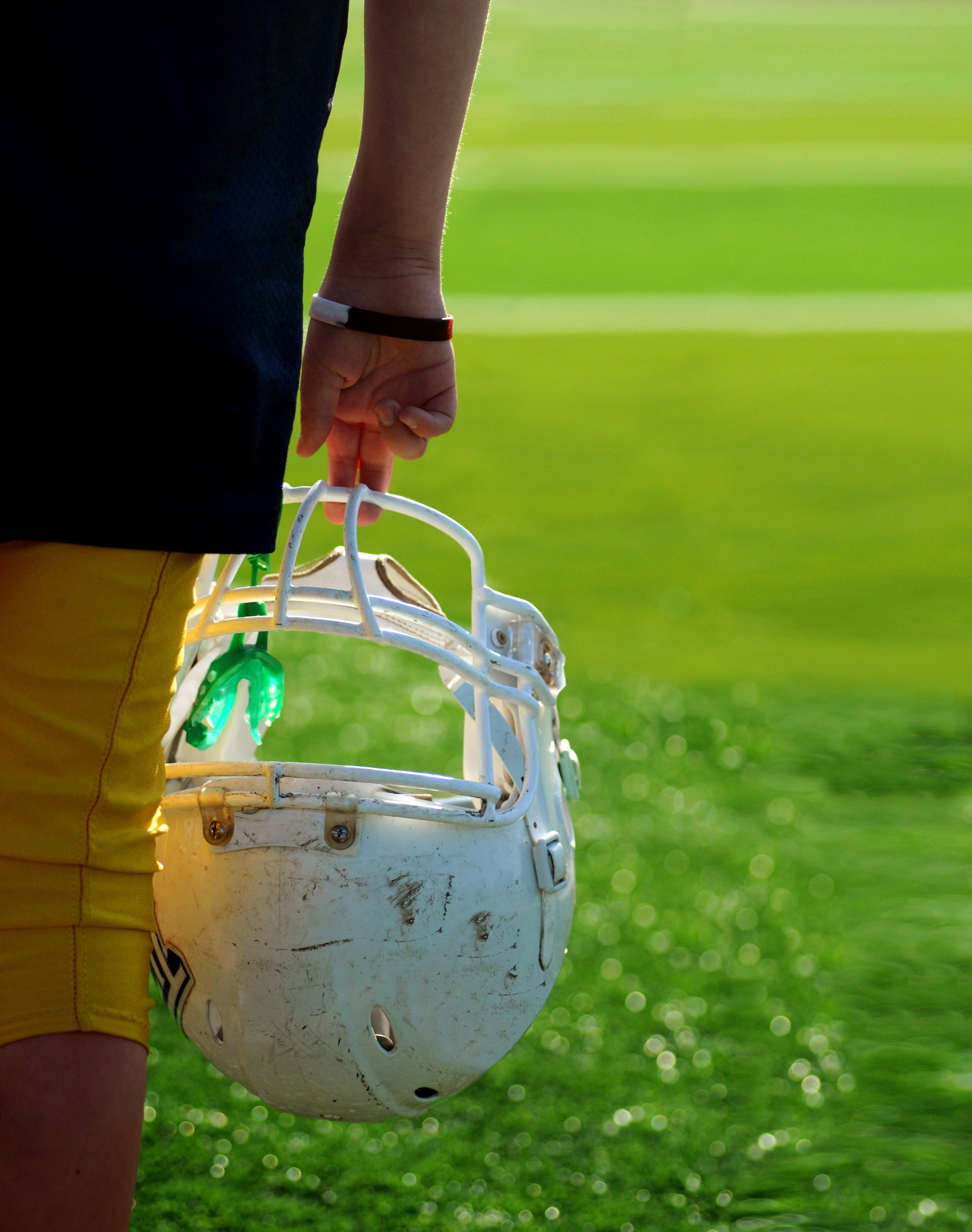 Football helmet and mouthguard Photo by Ben Hershey on Unsplash